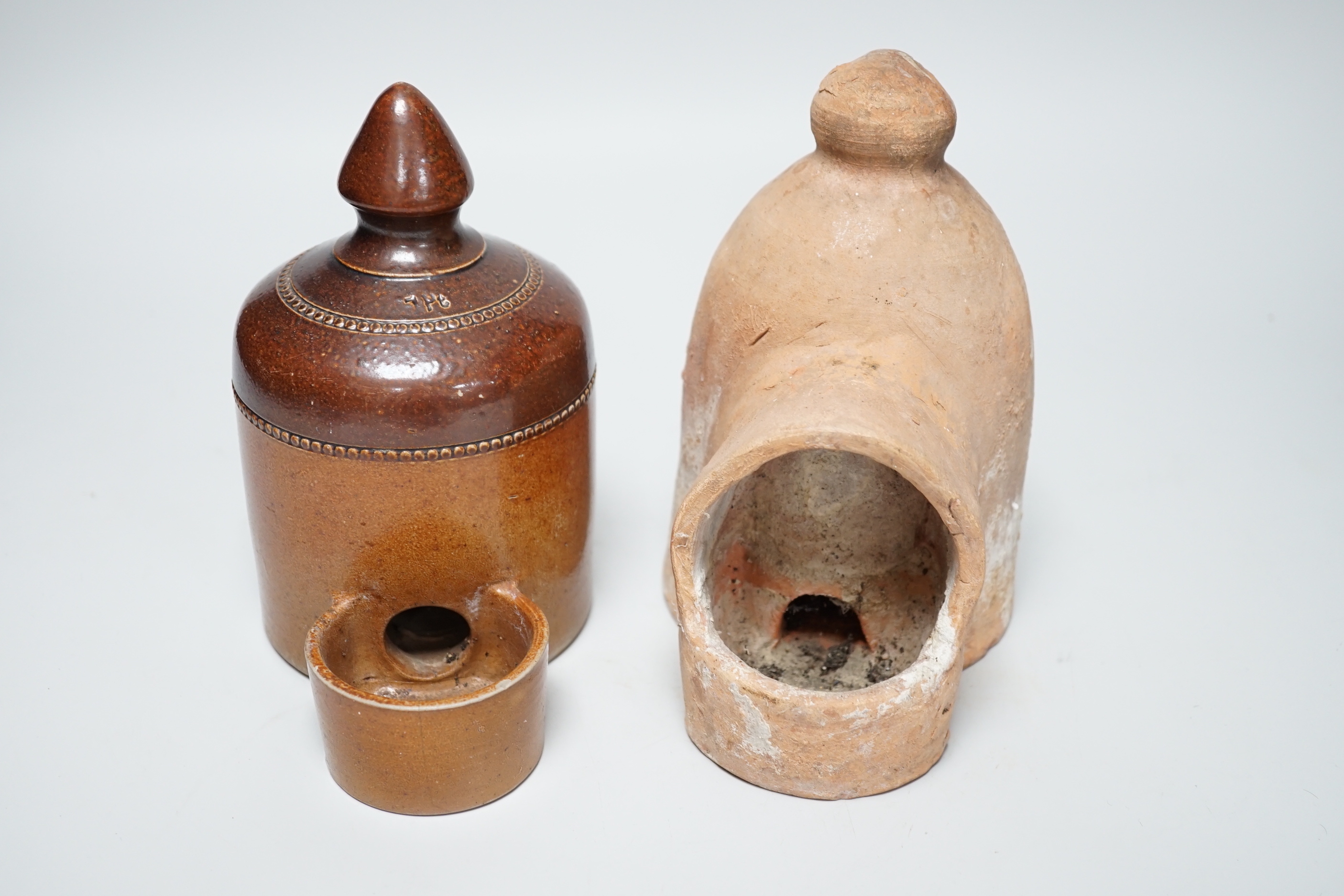 A late 18th / early 19th century Sussex pottery bird feeder and a Denby example, the largest 17cm high